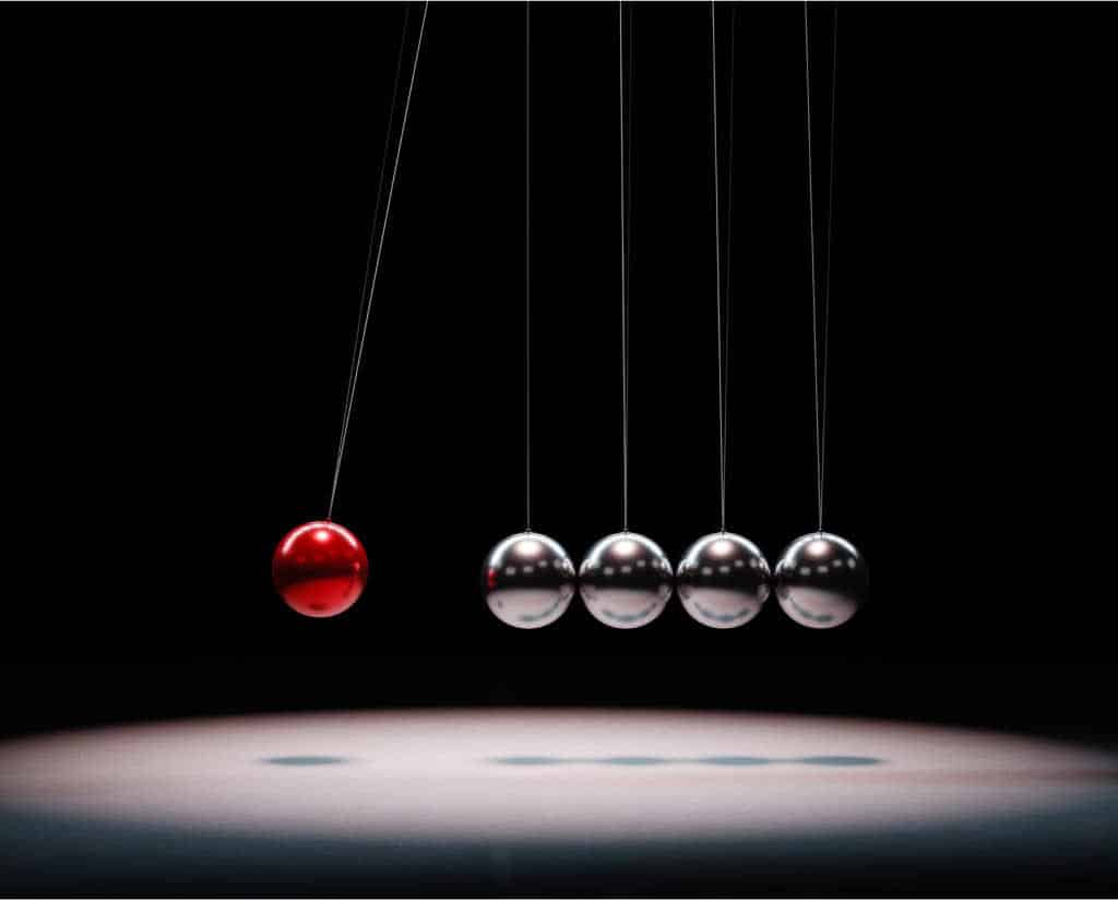 image of metal balls, symbolizing karmic cause and effect