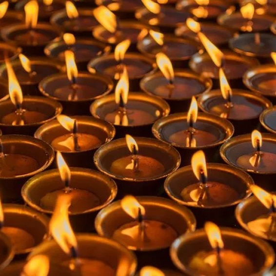 Numerous candles used for meditation all lit together