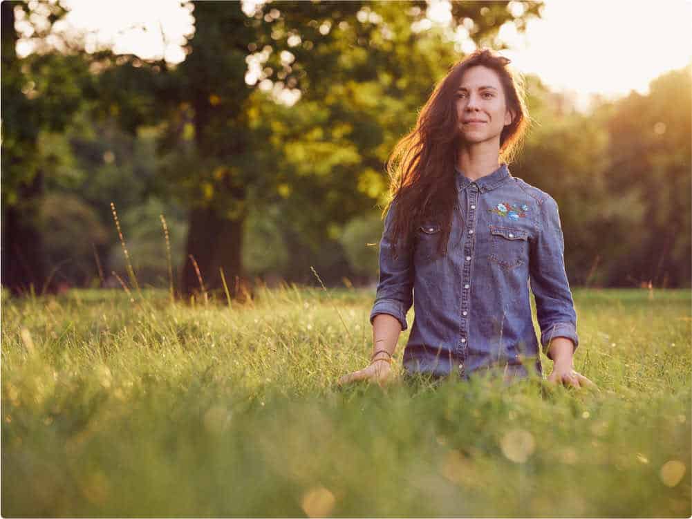 Woman Meditating in a field